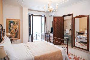 Ліжко або ліжка в номері Hotel Palazzo Krataiis