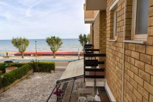 a balcony with a view of the ocean at Piccolo Hotel in Terracina