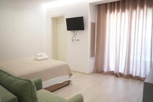 TV a/nebo společenská místnost v ubytování Hotel Veizi