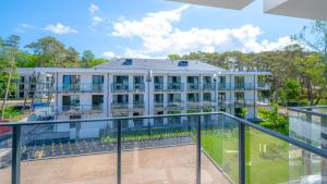 an exterior view of a building with a balcony at Ostseeresidenz Niechorze D305 Eco Boho - 5D Apartments in Niechorze