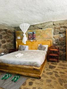 Katil atau katil-katil dalam bilik di Fichstone cave house 1bedroom