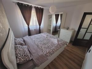 En eller flere senge i et værelse på Apartament Eva