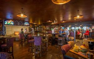 a group of people sitting at tables in a bar at The Inn at Dromoland in Newmarket on Fergus