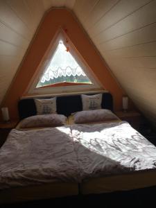 Postel nebo postele na pokoji v ubytování Ferienhaus mit Terrasse - Insel Usedom