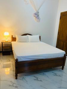 Postel nebo postele na pokoji v ubytování Lavender Resort