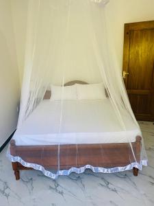 Postel nebo postele na pokoji v ubytování Lavender Resort