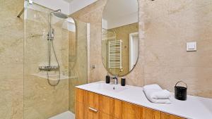 a bathroom with a sink and a shower at Rezydencja Niechorze D307 Eco Boho - 5D Apartments in Niechorze +15 photos