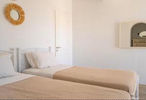 Postel nebo postele na pokoji v ubytování Villa Enthera Mykonos
