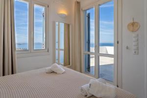 Postel nebo postele na pokoji v ubytování Villa Enthera Mykonos