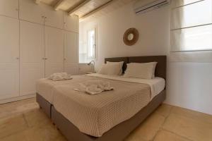 Postel nebo postele na pokoji v ubytování Villa Enthera Mykonos