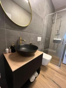 a bathroom with a black sink and a mirror at Tomislav in Sukošan +15 photos