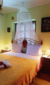 Ένα ή περισσότερα κρεβάτια σε δωμάτιο στο Traditional house at Pelion seaside