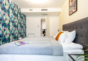 Łóżko lub łóżka w pokoju w obiekcie Classy Apartments - Ruska