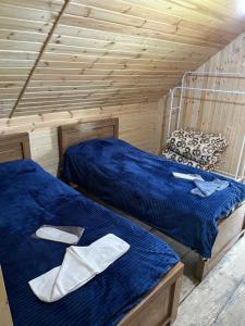 Ένα ή περισσότερα κρεβάτια σε δωμάτιο στο Guesthouse Malat