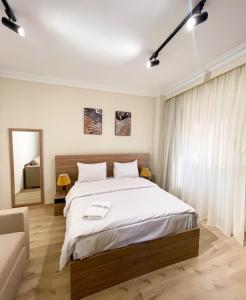 Postel nebo postele na pokoji v ubytování Settle Inn Banafseg Apartments + 23 fotografií