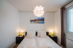 Postel nebo postele na pokoji v ubytování MyFlat Siófok Beach Apartment