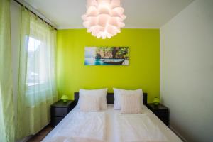 Postel nebo postele na pokoji v ubytování MyFlat Siófok Beach Apartment