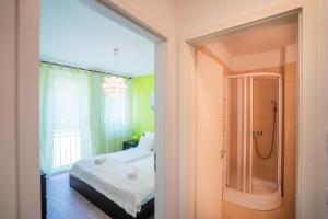 Postel nebo postele na pokoji v ubytování MyFlat Siófok Beach Apartment