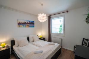 Postel nebo postele na pokoji v ubytování MyFlat Siófok Beach Apartment + 28 fotografií