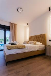 En eller flere senge i et værelse på Luxury apartment KaLeGa