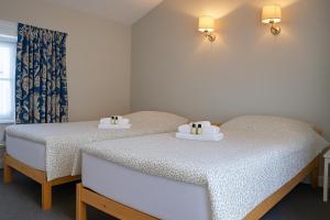 Una cama o camas en una habitación de The Monkey Puzzle