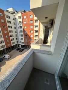 a view from the balcony of a apartment building at Bright flat in Fushë Kosova in Kosovo Polje