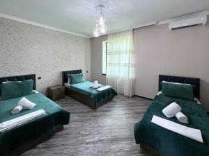 Postel nebo postele na pokoji v ubytování Resort Villa Gabala + 32 fotografií
