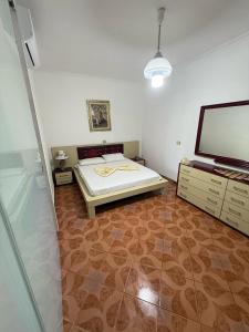 Ένα ή περισσότερα κρεβάτια σε δωμάτιο στο Babas House