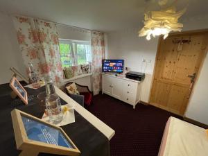 Telewizja i/lub zestaw kina domowego w obiekcie K&B Residence