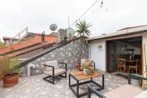 a patio with a staircase and a table and chairs at 3BR Villa with Garden & Terrace in Kadikoy in Istanbul