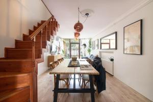 a dining room with a table and a staircase at 3BR Villa with Garden & Terrace in Kadikoy in Istanbul +19 photos