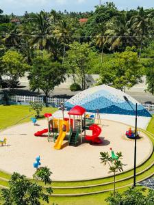 a playground in a park with a play area at Airport S4 Apartment in Negombo