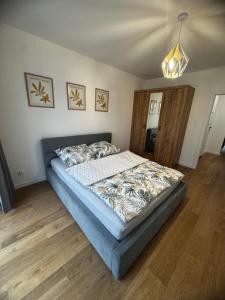 Ένα ή περισσότερα κρεβάτια σε δωμάτιο στο Apartament Maja +1 φωτογραφίες