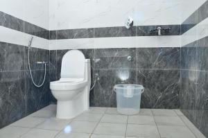 a bathroom with a toilet and a shower at Cheerful Chalet in Kodaikānāl +40 photos