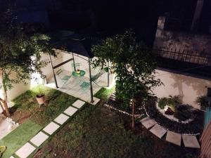an overhead view of a garden at night at Nostos in Nea Moudania +5 photos