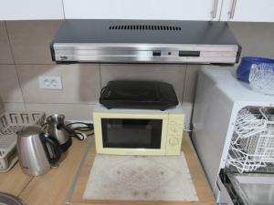 Una cocina o zona de cocina en AQUA LUX APARTMAN