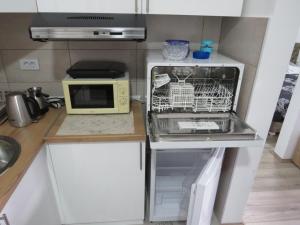 Una cocina o zona de cocina en AQUA LUX APARTMAN