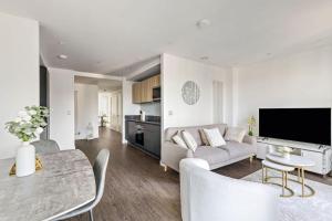 a living room with a couch and a table at TM luxury apartments in London