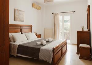 Postel nebo postele na pokoji v ubytování Villa Eros + 17 fotografií