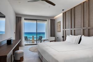 Voodi või voodid majutusasutuse Mosay All Suite Hotel toas +37 fotot