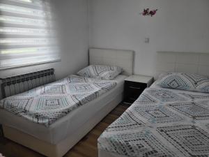 Postel nebo postele na pokoji v ubytování Apartment & Room TOMA