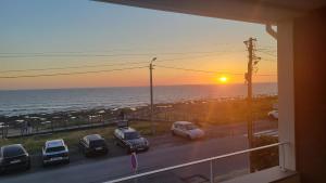 a view of a parking lot with a view of the ocean at Granja Beach Front in São Félix da Marinha