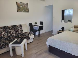 Posteľ alebo postele v izbe v ubytovaní Apartment & Room TOMA