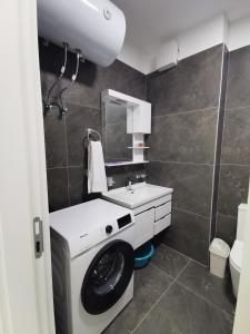 a bathroom with a sink and a toilet at SeaBreeze Apartments in Golem