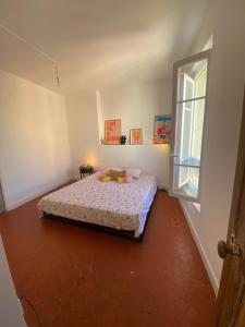 Ένα ή περισσότερα κρεβάτια σε δωμάτιο στο Superbe Appartement au coeur d ajaccio