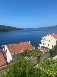 a group of buildings and a large body of water at Bigova Peace Oasis in Bigovo