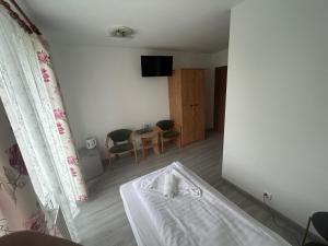 Postel nebo postele na pokoji v ubytování Veno- Niechorze