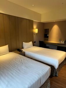 Postel nebo postele na pokoji v ubytování CHECK inn SELECT Taipei NeiHu