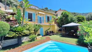 a villa with a swimming pool in a garden at Villa in Nice French Riviera in Nice