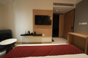 TV a/nebo společenská místnost v ubytování Hotel Cachet + 19 fotografií